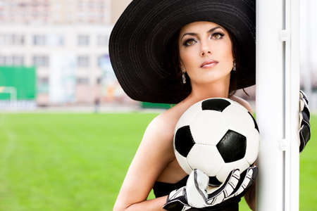 Elegant woman with Football ballの写真素材