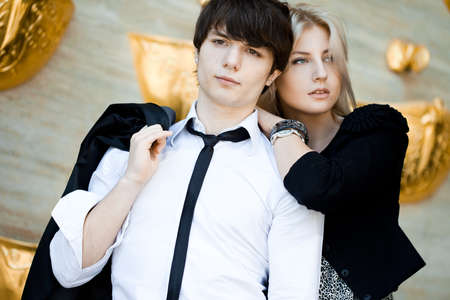 couple - girl and guy near the wallの写真素材