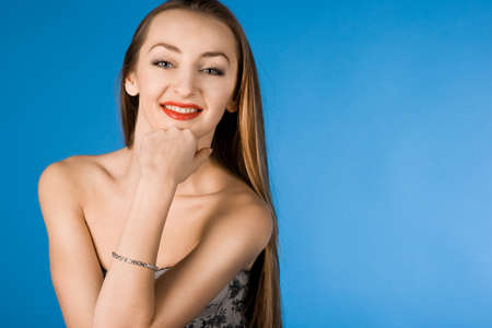 pretty girl on blue backgroundの写真素材