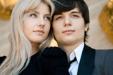 couple - girl and guy near the wallの写真素材