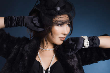 elegant fashionable woman in a hatの写真素材