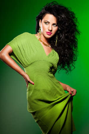 elegant fashionable woman on greenの写真素材