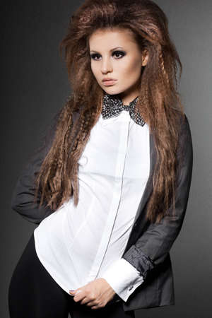 elegant fashionable woman with bow-tieの写真素材