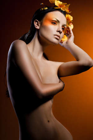 elegant fashionable woman with orchidの写真素材