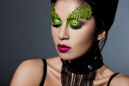 elegant fashionable woman with art visage