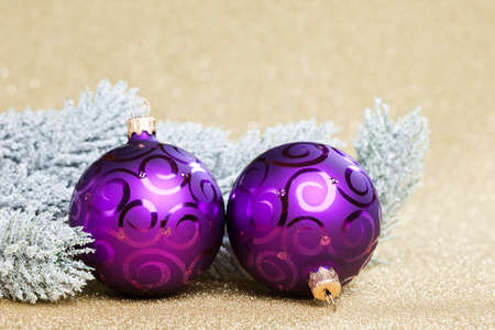 branch of Christmas tree with snow and ballの写真素材