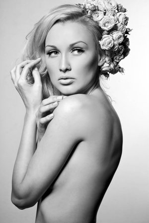 elegant fashionable woman with flowersの写真素材