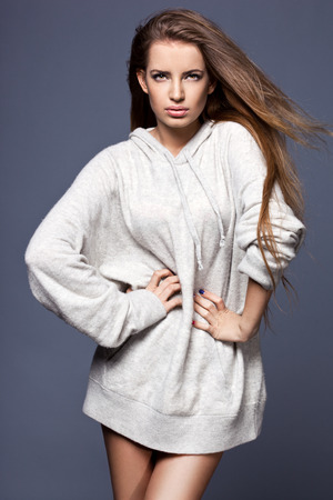 beautiful woman in grey sweaterの写真素材
