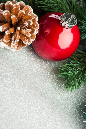 Christmas ball with fir-tree and pineconeの写真素材
