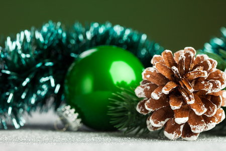 Christmas ball with fir-tree and pineconeの写真素材
