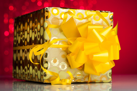 Gift box  on sparkles backgroundの写真素材