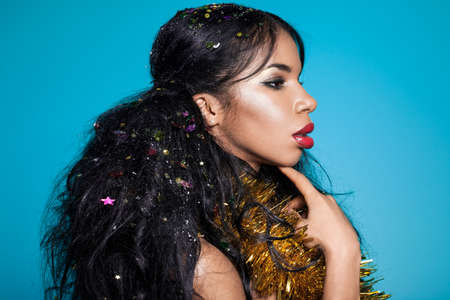 Elegant mulatto girl with garlandの写真素材