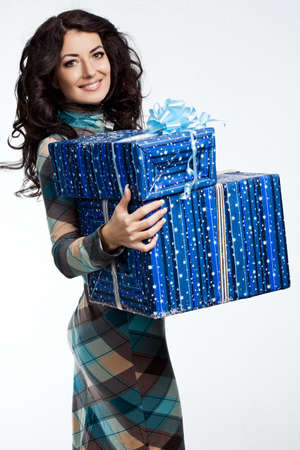 beautiful fashionable woman with gift boxの写真素材