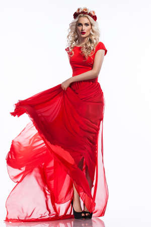 woman in red dress on white backgroundの写真素材