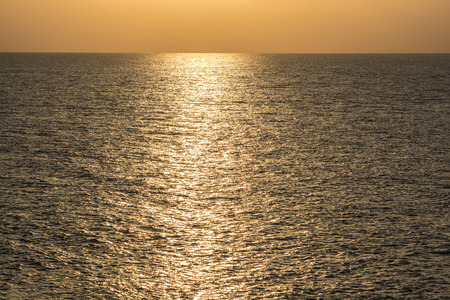 golden shimmering Sea Water with wave,Sun light refection on sea water.の写真素材