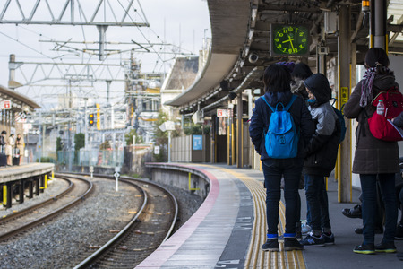 KYOTO, JAPAN - MARCH 18, 2017: People waiting for the train.のeditorial素材