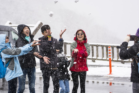 NIKKO, JAPAN - MARCH 21, 2017: Happy family in winter, having fun with snow outdoors.のeditorial素材