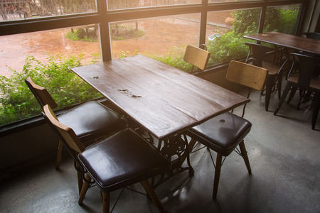 BANGKOK, THAILAND - AUGUST 5, 2017: Wooden tables and chairs in coffee shop.のeditorial素材