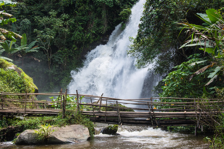 Pha Dok Siao Waterfall Chiangmai Province Thailand, Beautiful water fall in Thailand,Bamboo bridge for cross the waterfall.の写真素材