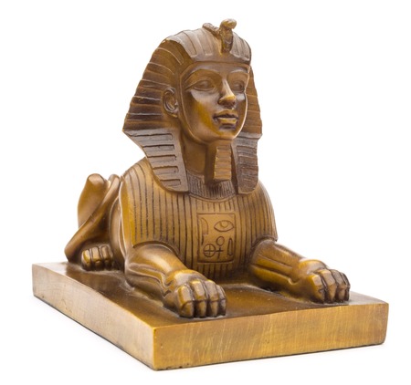 figurine of a sphinx on a white backgroundの写真素材