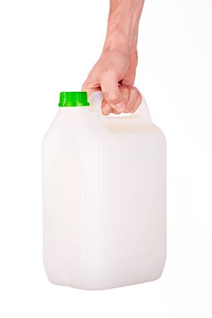 plastic canister in hand on white backgroundの写真素材