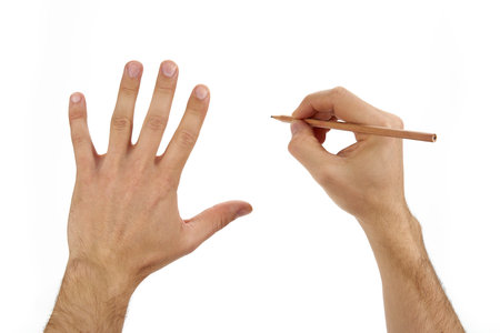 Hand draws with a pencil on a white backgroundの写真素材