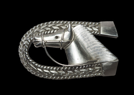 The horses steel belt buckles isolated on blackの写真素材