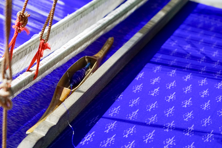 Silk Production Process, Silkworm cocoons.Colorful raw silk thread in country of asia.Raw silk thread background.Thai silk on the loom.Thai traditional weaving with loomの写真素材