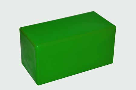 Green plastic cube an element of a game pyramidの写真素材