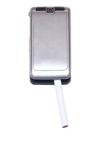 Phone with cigarette isolated on white backgroundの写真素材