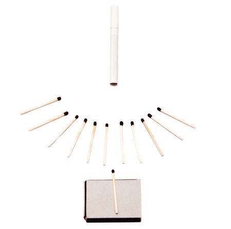 Box of matches with cigarette on white backgroundの写真素材