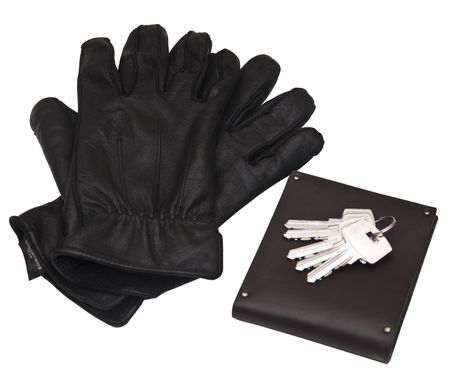 Black man's gloves with purse and keysの写真素材