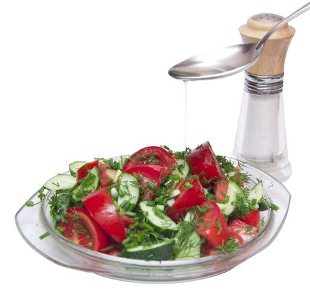 tomatoes and cucumbers on the cutting boardの写真素材