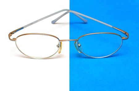 glasses for eyes on white and blue backgroundの写真素材