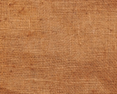 textured background of a sandy brown burlap cloth の写真素材