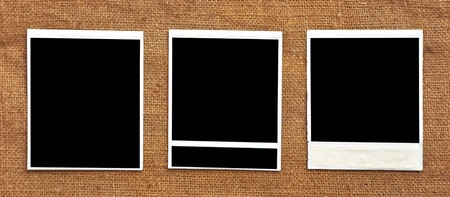 three frames attached against a textile backgroundの写真素材