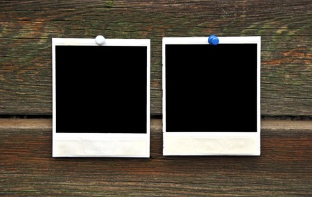 two blank photo frame on wooden background の写真素材