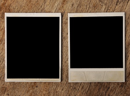two blank photo frame on wooden background の写真素材