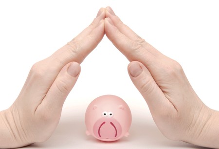 toy pink pig and folded house handsの写真素材