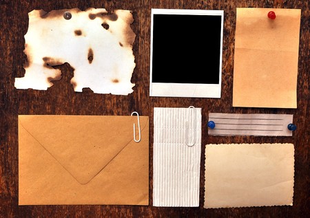 bulletin board with paper notes and old blankの写真素材