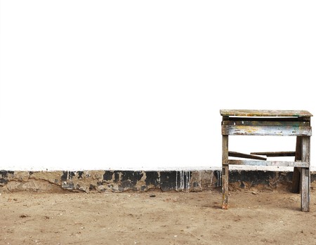 old ladder against a white wall, you can use for textの写真素材