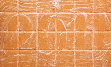 word "2011" made of foam on wall tileの写真素材