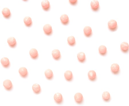pink beautiful sweet candies on white background.の写真素材