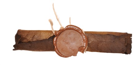 very old paper with a wax seal on a white backgroundの写真素材