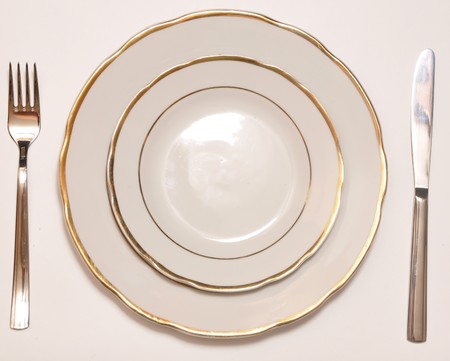 white plate with silver fork and knife の写真素材