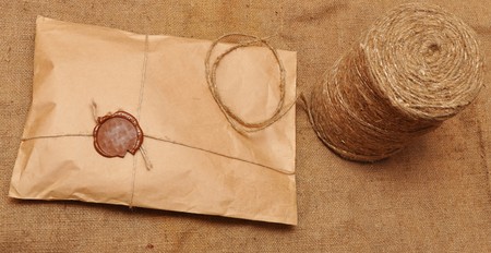 string hank and parcel on sack backgroundの写真素材