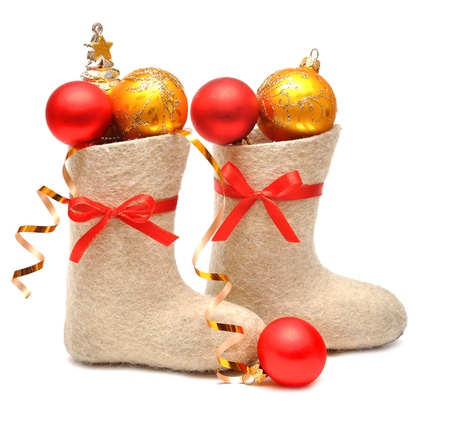 children's boots full gifts on whiteの写真素材