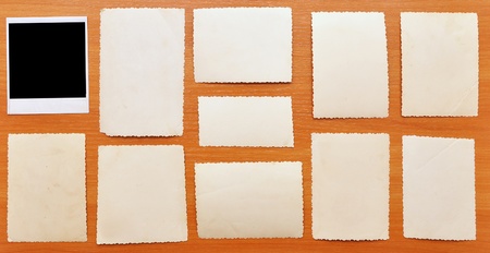 collection of old photos on wood backgroundの写真素材