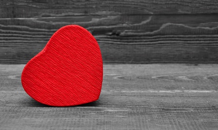 red box in heart shape on wood backgroundの写真素材