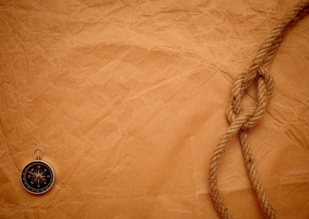 compass and rope on old yellow paper  の写真素材